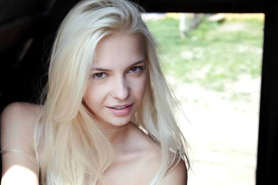 16P Blonde Russian girl Leonie models totally naked while in a barn