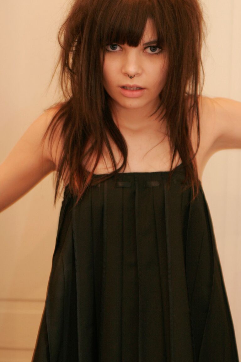 15P Petite girl Kaira 18 smokes while getting totally naked behind a closed door