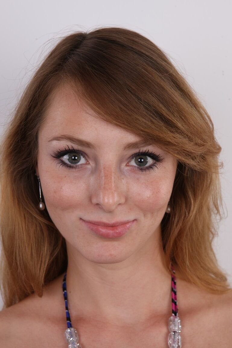20P Amateur model with freckles removes her clothes on item at a time