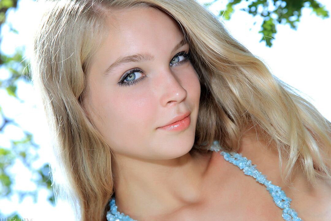 12P Erotic blonde doll with small tits and ass chilling naked in a tree