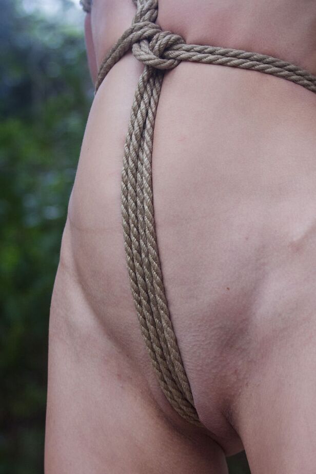 16P Skinny chick Jacinta B is tied up and suspended by rope in the woods