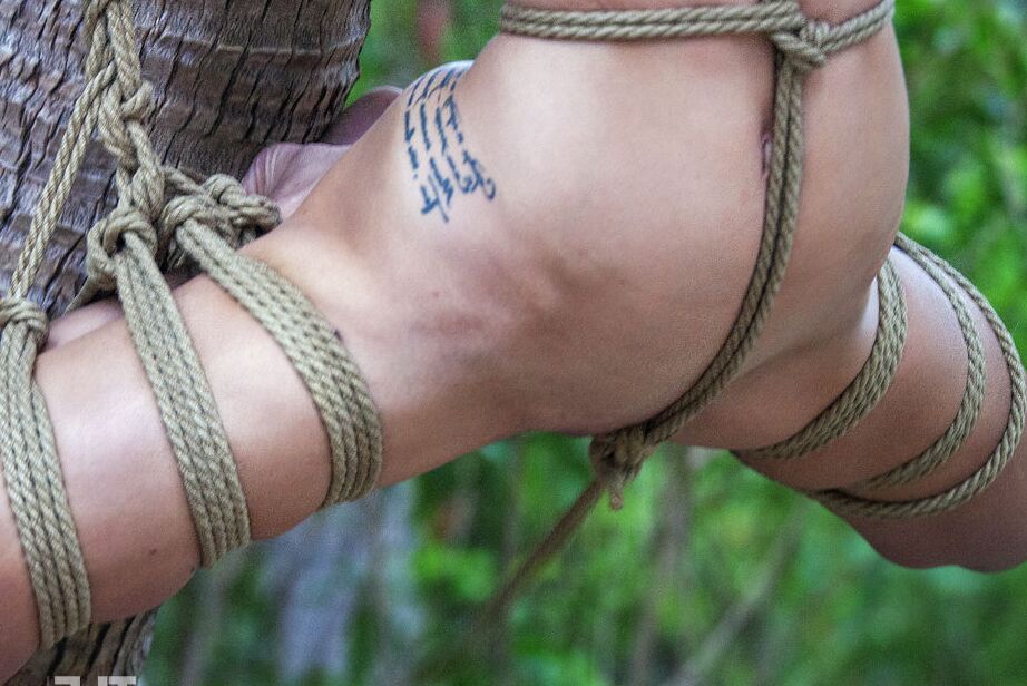 16P Skinny chick Jacinta B is tied up and suspended by rope in the woods