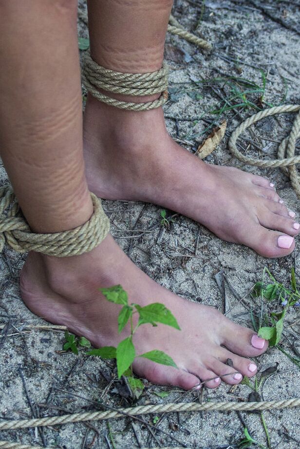 16P Skinny chick Jacinta B is tied up and suspended by rope in the woods