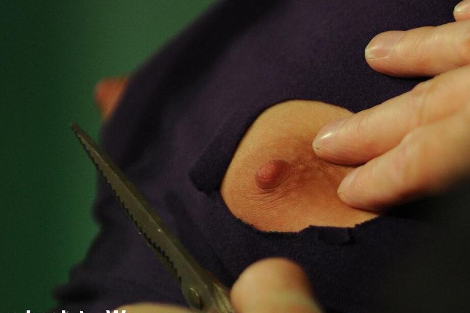 16P Brunette female is threatened with wax while suspended in a bondage swing