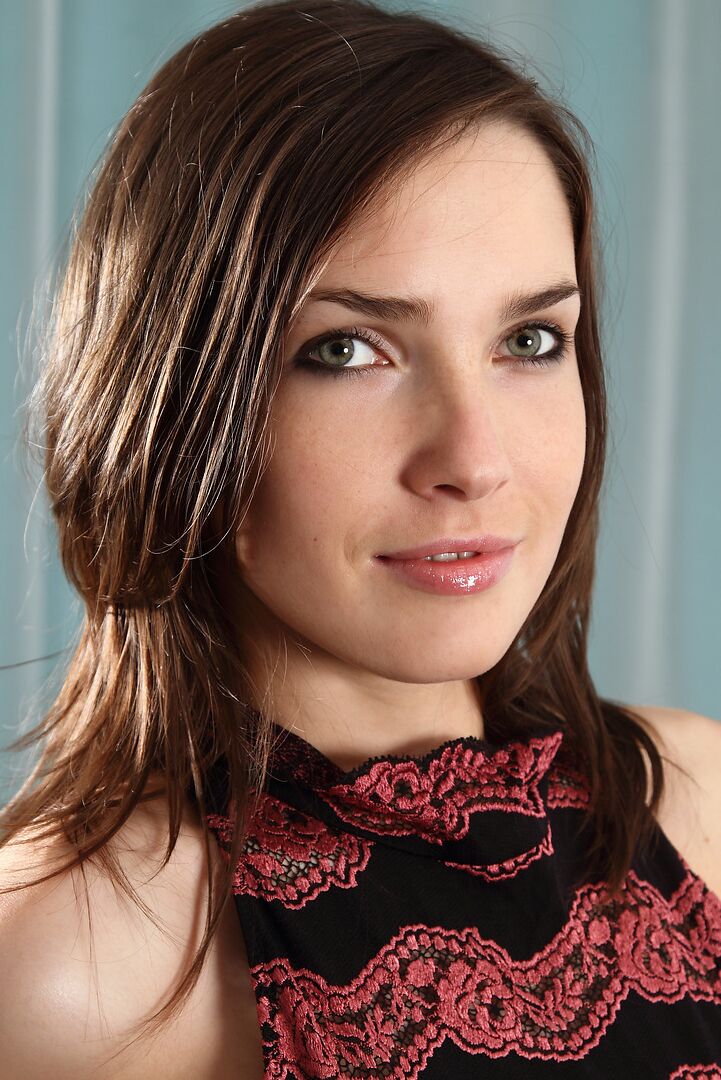 12P Pretty brunette undressing on the leather couch to show her hairy muff