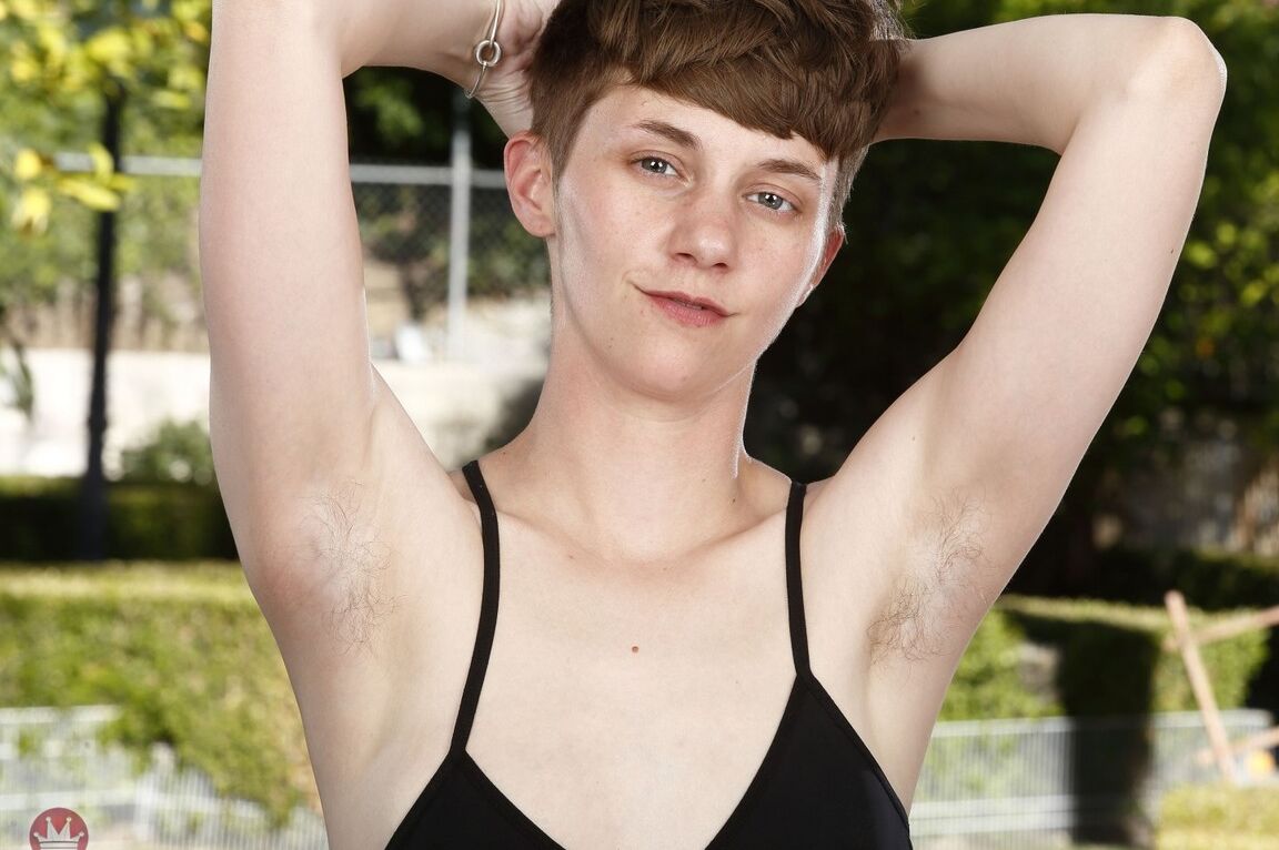 21P Short haired teen Mercy West exposes her bushy twat and hairy armpits