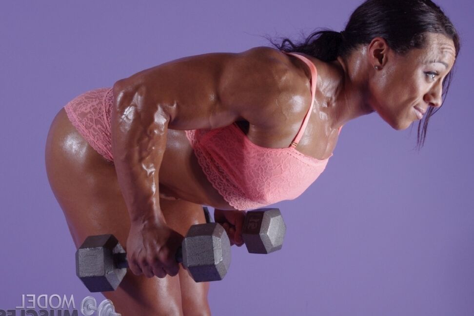 21P Horny bodybuilder Karen Garrett	flaunts her muscles while lifting weights