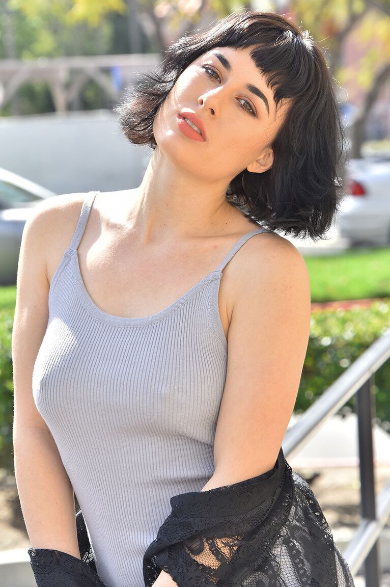 15P Dark-haired girl exposes herself in public before getting naked indoors