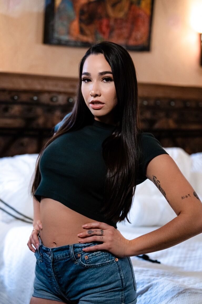 15P Lena Paul uncovers her big tits on a bed while Karlee Grey exposes a black bra