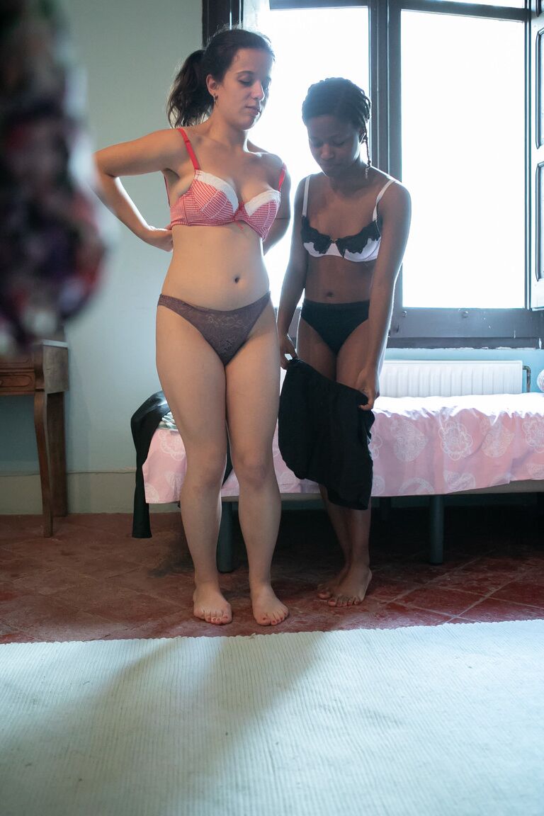 21P Canadian babe Alessia & a dark skinned lesbian putting clothes on each other