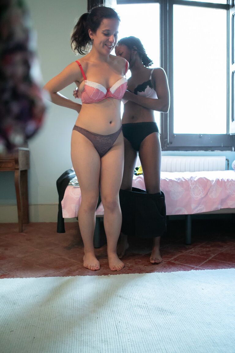 21P Canadian babe Alessia & a dark skinned lesbian putting clothes on each other