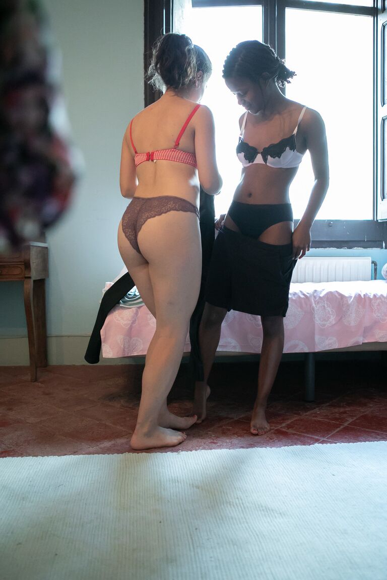 21P Canadian babe Alessia & a dark skinned lesbian putting clothes on each other