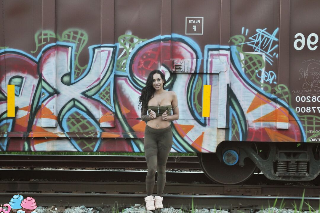 12P Busty tattooed babe Cindy Cupcakes shows off her perfect round ass in front of