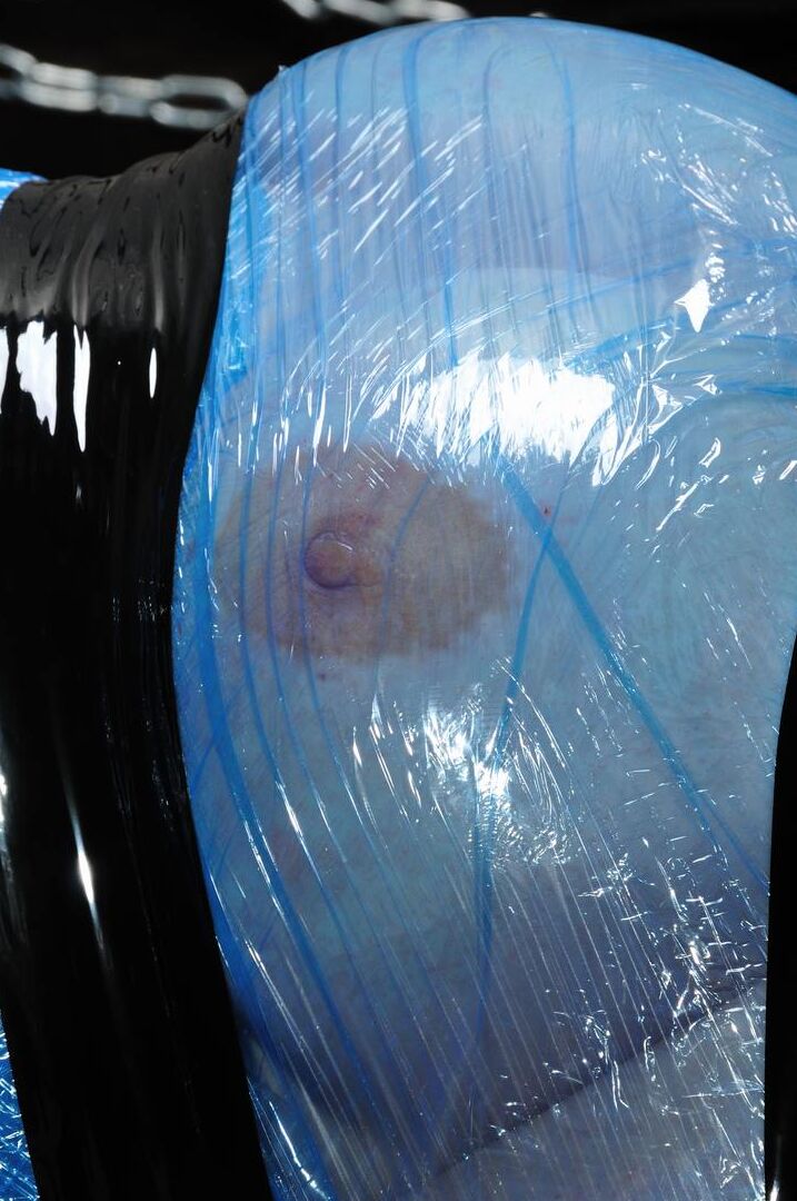 12P Naked blonde finds herself encased in saran wrap and duct tape