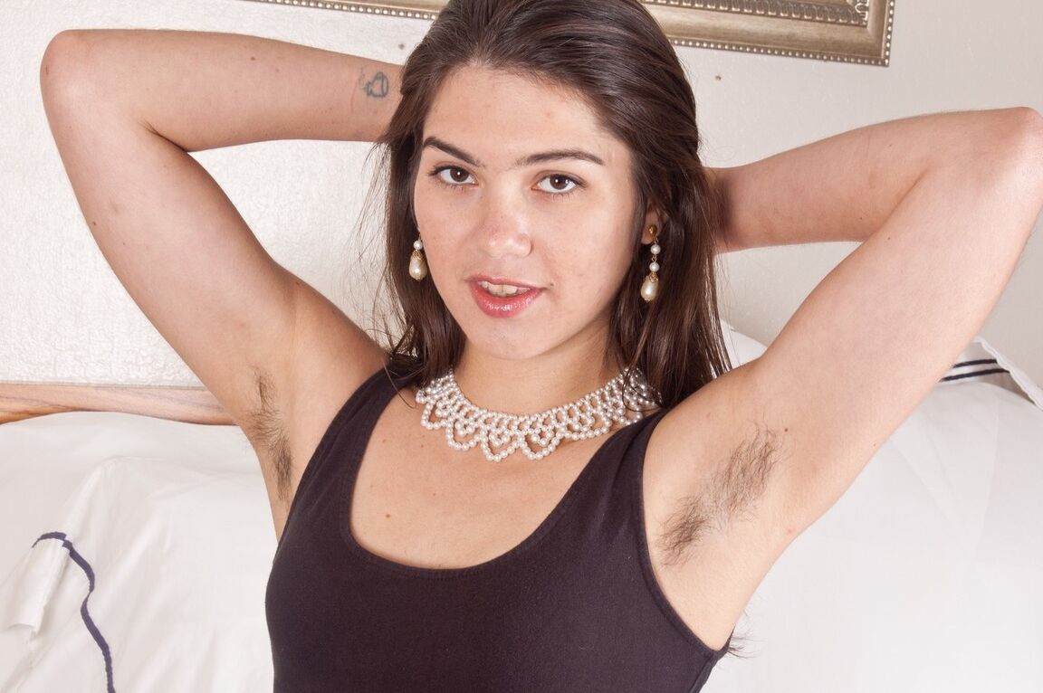 13P Petite solo girl reveals her hairy armpits and twat while disrobing