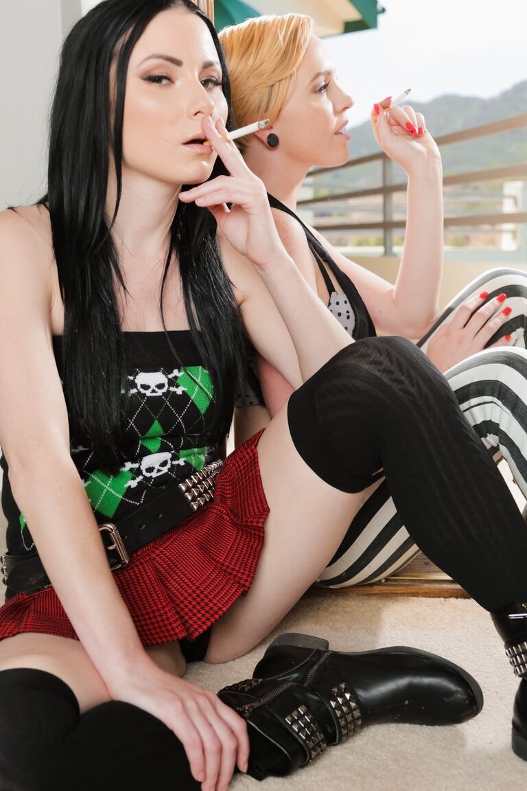 15P Lesbian women Veruca James and Miley May smoke while fully clothed