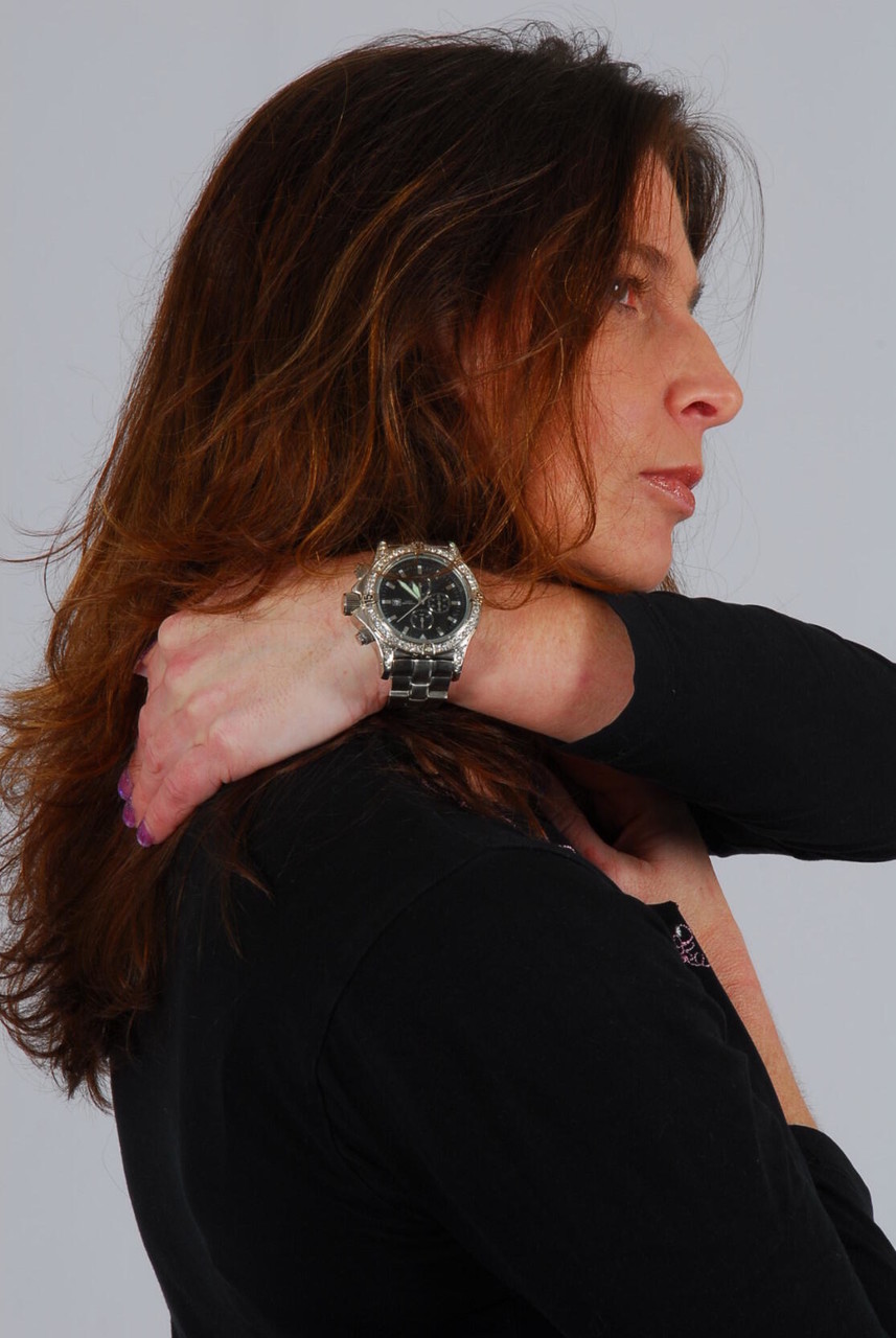 16P Caucasian model Felicia takes a glance at her huge metal watch while dressed