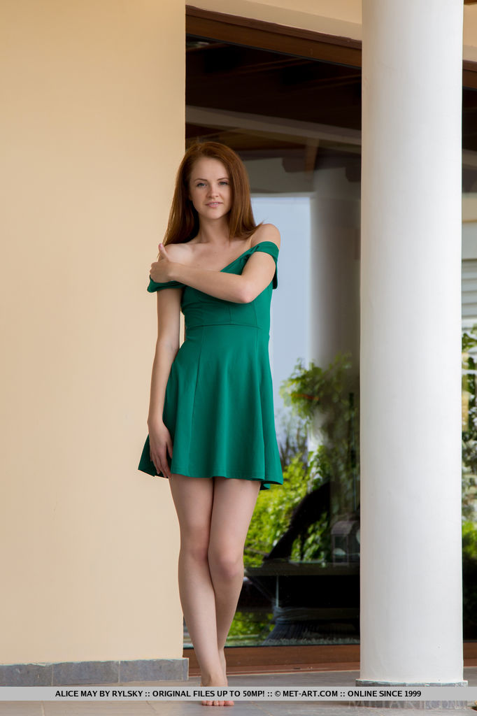 18P Sexy redhead Alice May models naked on balcony after stepping out of dress