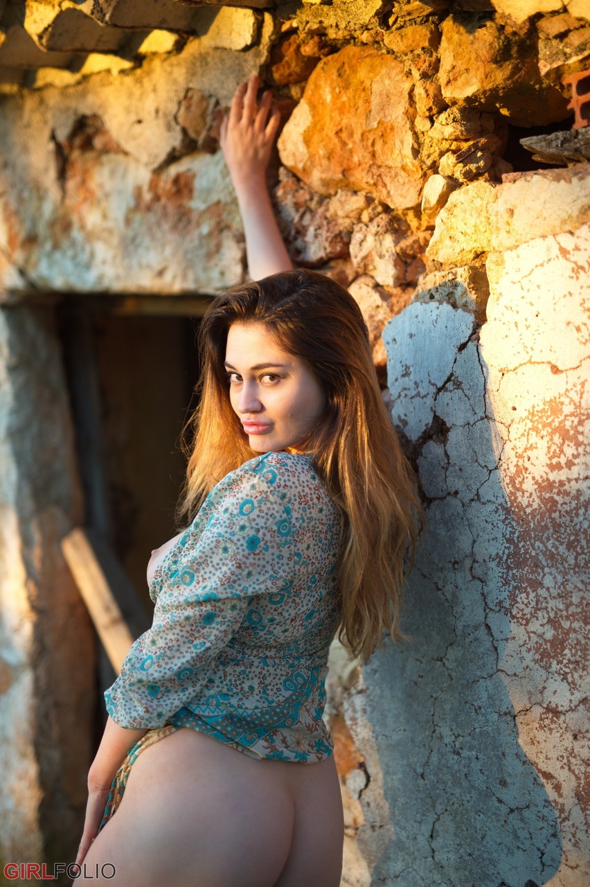 12P Solo model Gabriella Knight shows some tits and ass by an old outbuilding