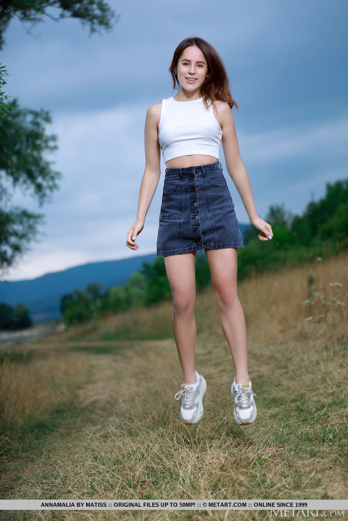 18P Nice teen Annamalia grabs her phat ass while naked on a path in a field