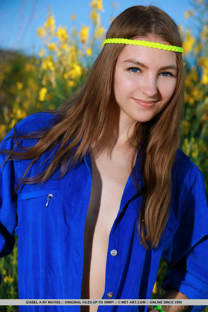 18P Russian teen Izabel A poses totally naked in front of a bush in bloom