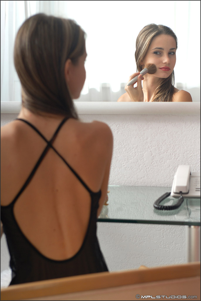 12P Beautiful solo girl admires her perfect ass in a mirror on the wall