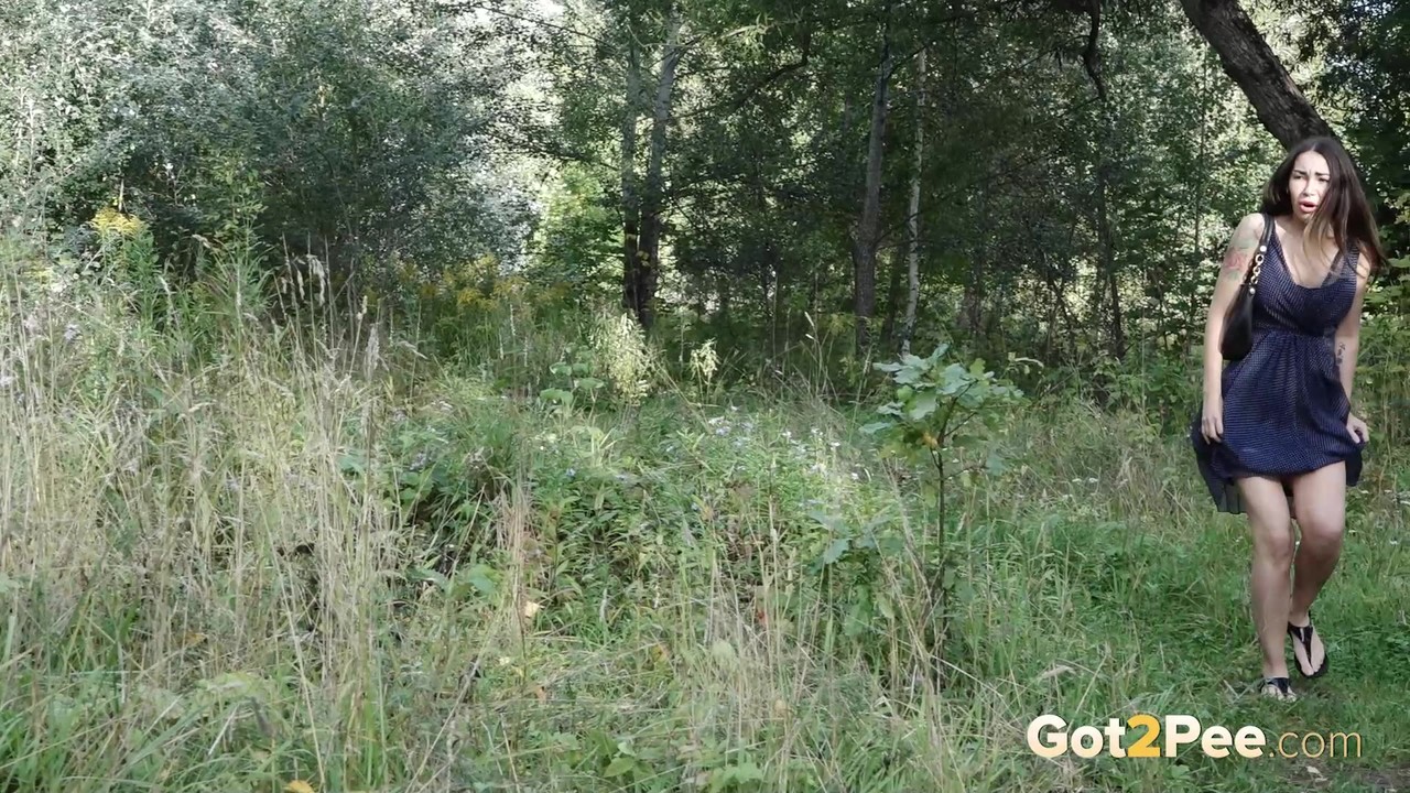 15P Brunette chick Sasha squats for a pee in front of a birch tree in the country