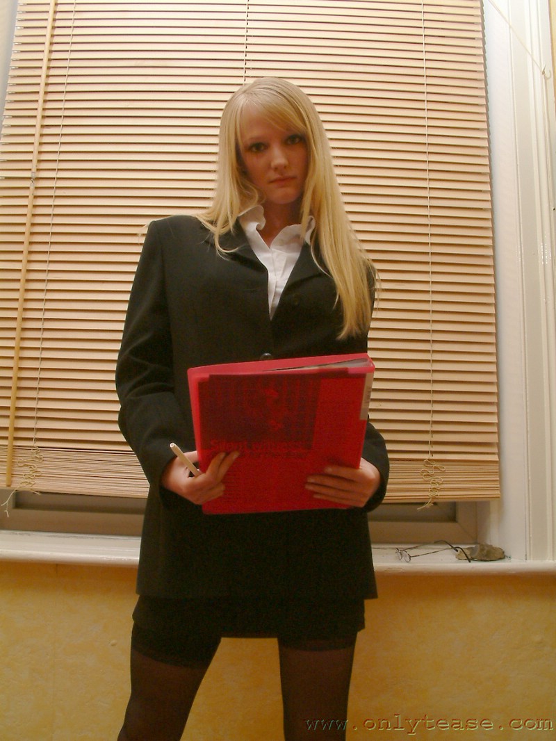21P Skinny office doll Sharon strips by the window and poses in lingerie