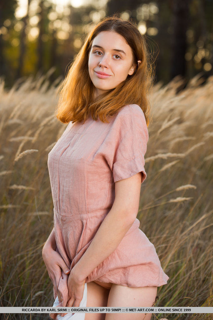 18P Teen girl next door type Riccarda displays her tight slit while naked in field
