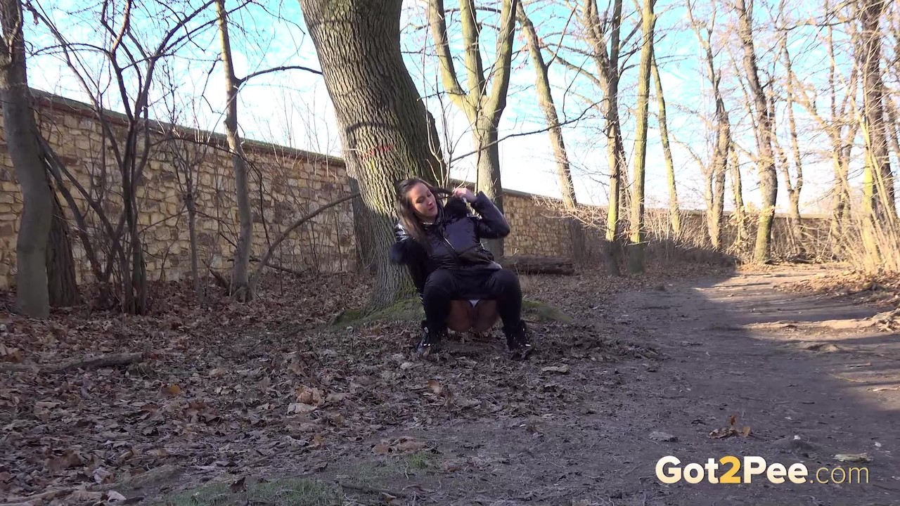 15P Naomi Benet squats in the woodland to piss