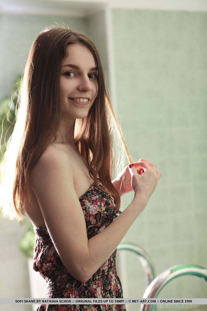 18P Nice teen Sofi Shane gets totally naked as readies for a dip in an indoor pool