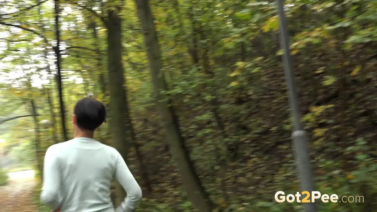 15P Female jogger Gabriellla Gucci pulls down her leggings for a pee in the woods