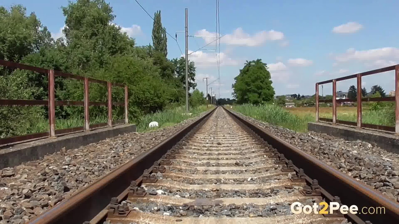 15P Solo girl Antonia Sainz squats for a piss while on railway tracks