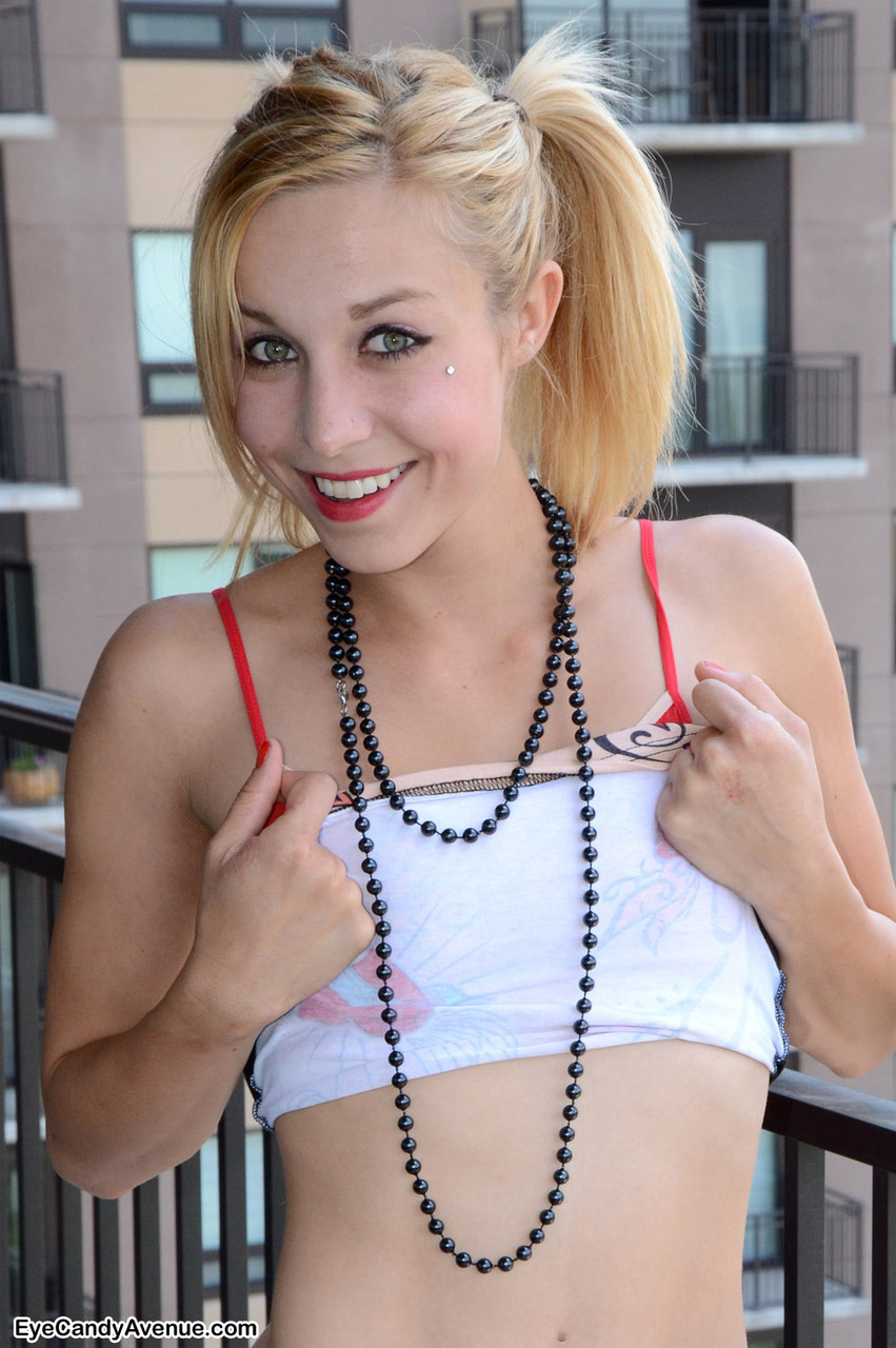 16P Sexy Marissa on a balcony over looking the city