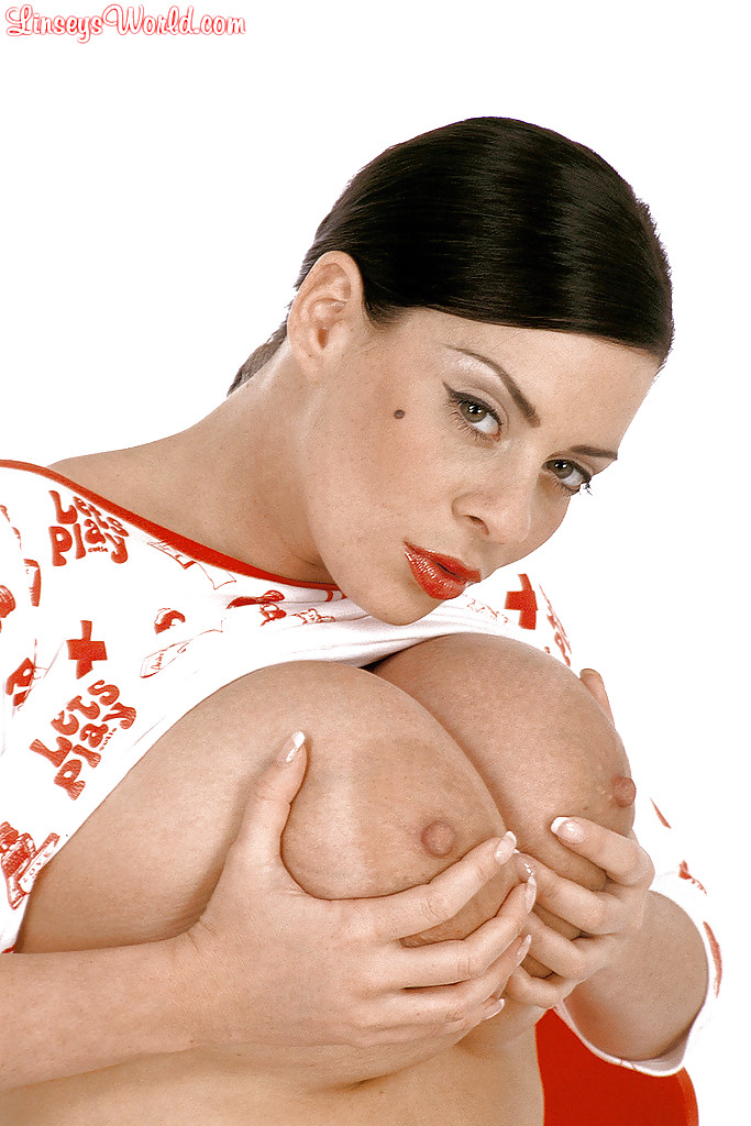 16P Big titted babe Linsey Dawn McKenzie posing on heels and playing with her cooter