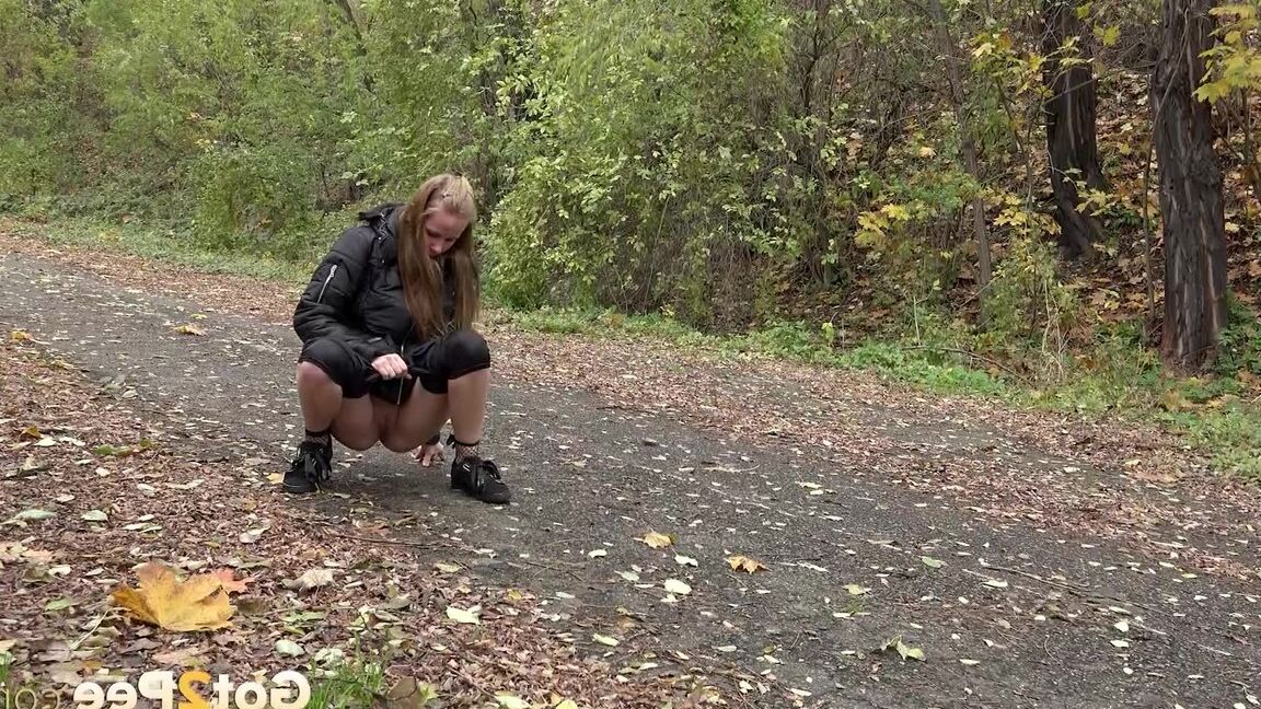 15P Cute shy girl pisses all over the path outside