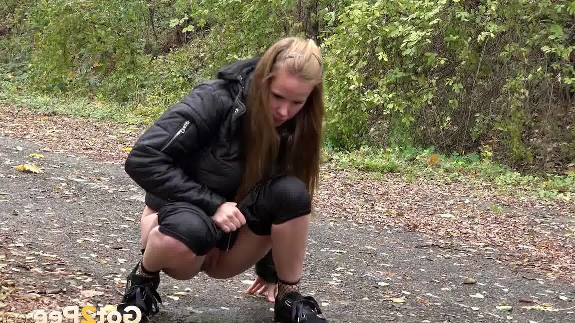 15P Cute shy girl pisses all over the path outside