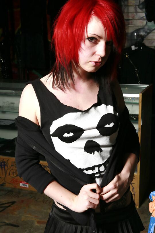 15P Redheaded punk Uzi gets naked by herself in hosiery and black boots