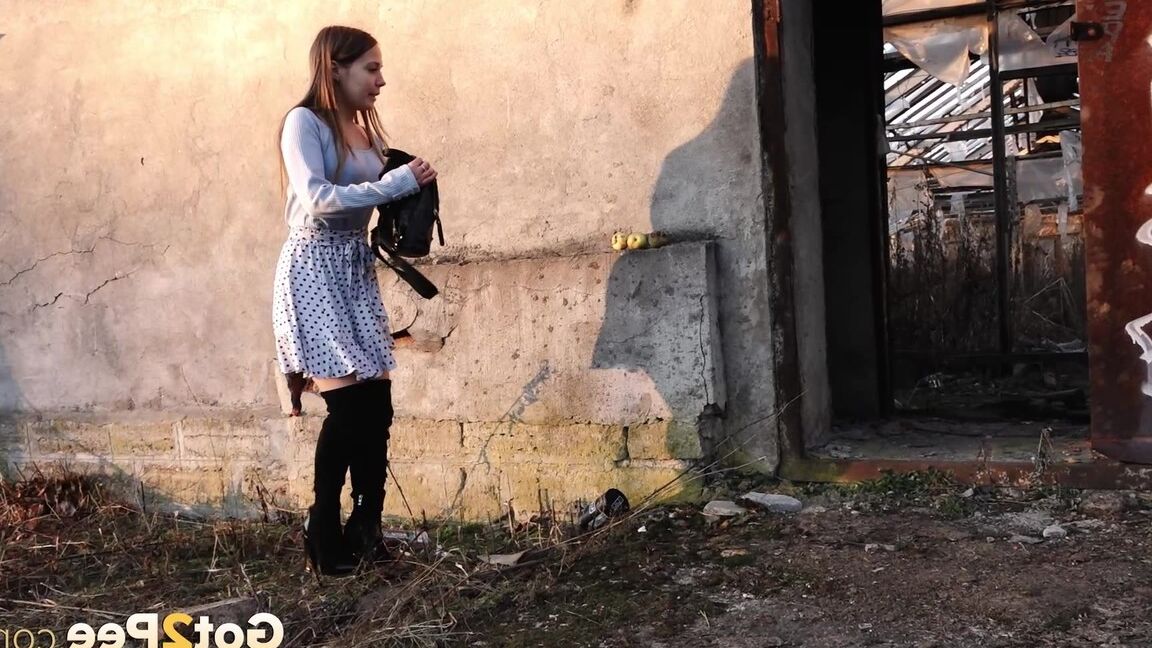 15P Sweet brunette squats and pees on the ground