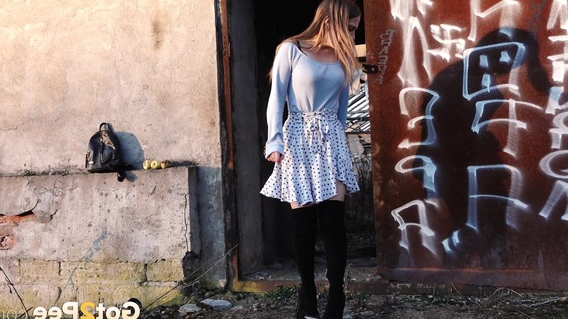 15P Sweet brunette squats and pees on the ground