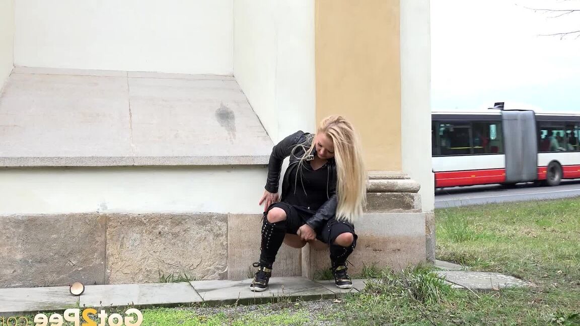 15P Cute blonde squats outside in the wind to piss