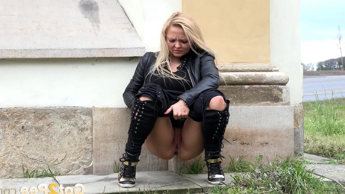 15P Cute blonde squats outside in the wind to piss