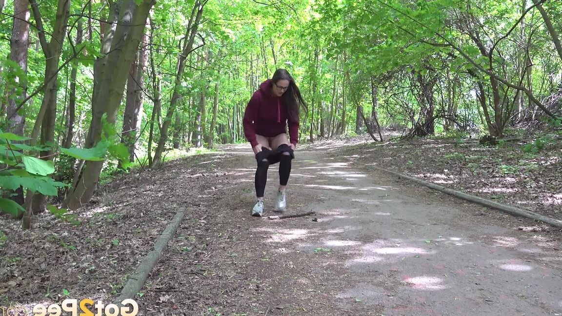 15P Gorgeous dark haired babe squats and pees outside