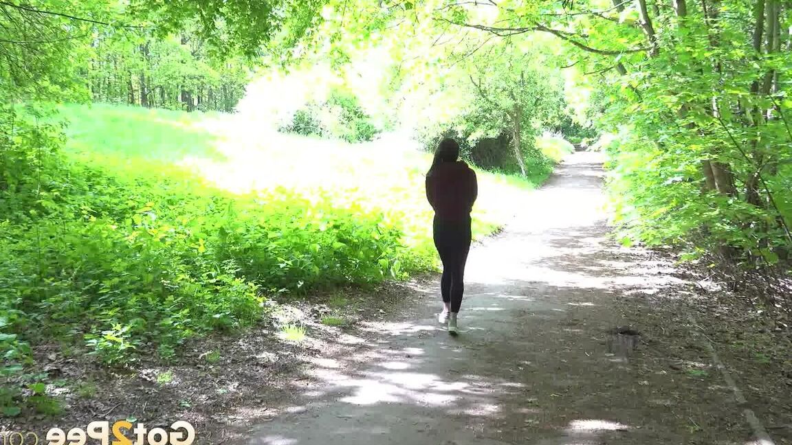 15P Gorgeous dark haired babe squats and pees outside