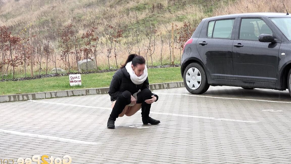 15P Eveline Neill squats to piss in a car park