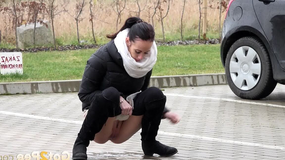 15P Eveline Neill squats to piss in a car park