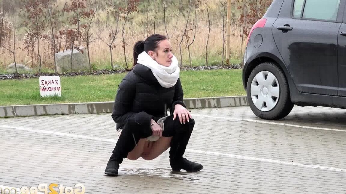 15P Eveline Neill squats to piss in a car park