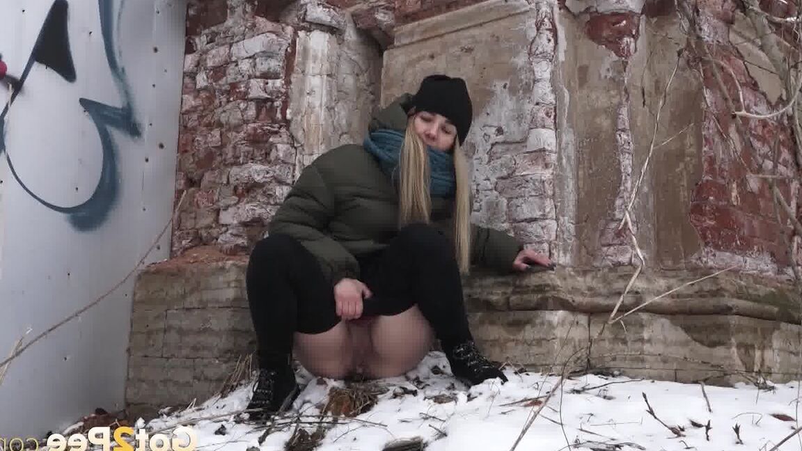 15P Blonde sits in the snow and relieves herself