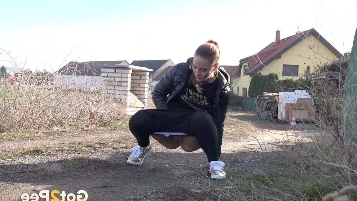 15P Naomi Benet relieves herself in the suburbs
