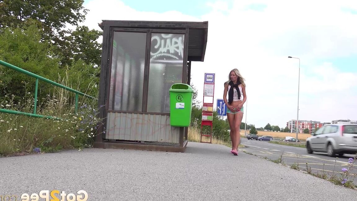 15P Claudia Macc pees in public at a bus stop